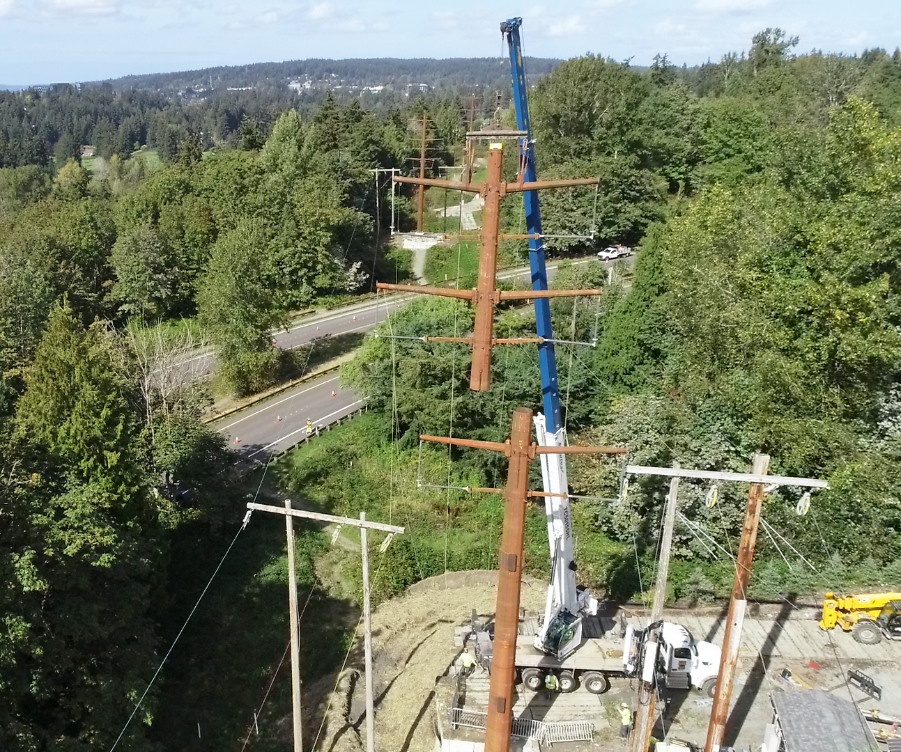 Aerial view of top of last pole moving into place for the Energize Eastside project